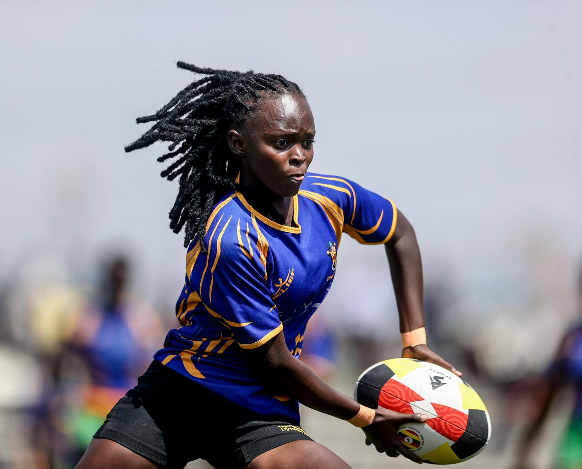 An African women rugby player in dynamic action during a match in Kampala, Uganda, evoking the spirit of African women rugby.