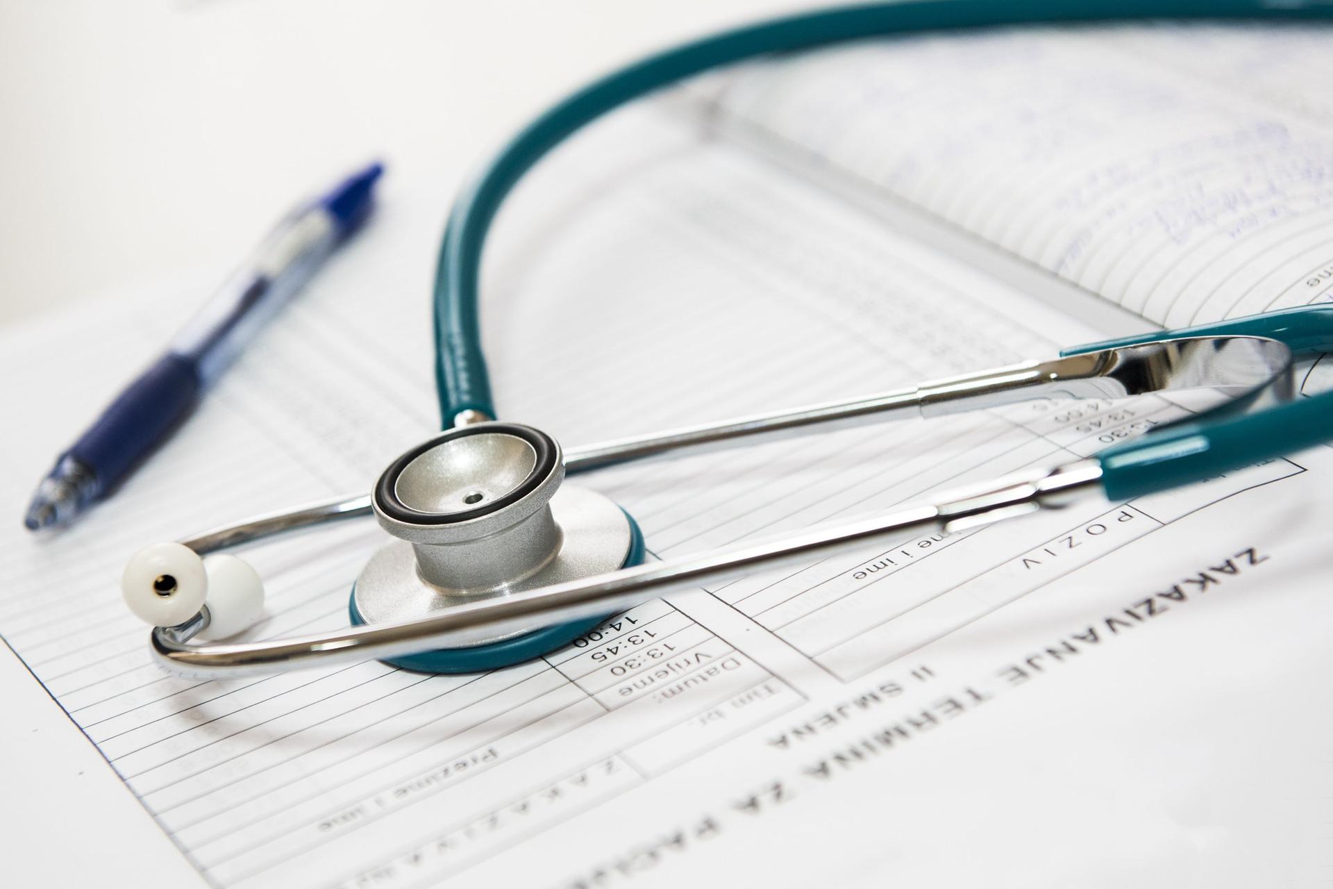 A doctor in a white coat holds a stethoscope, representing a young physician's medical career