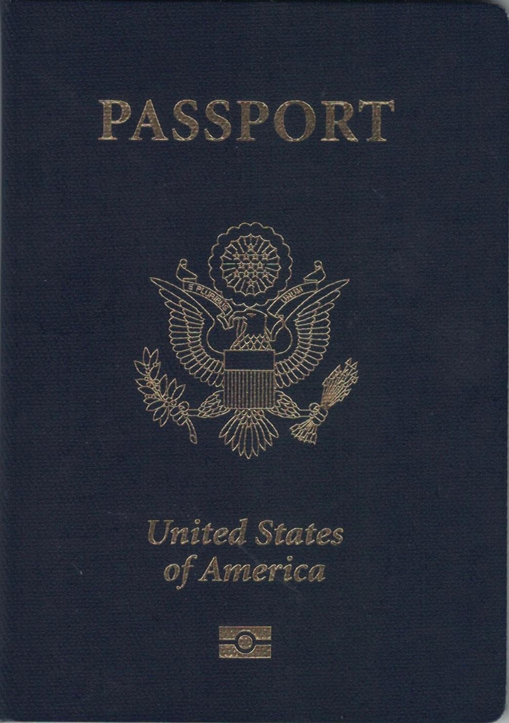A blue United States passport on a flat surface, the small document at the centre of every adjustment-of-status decision.