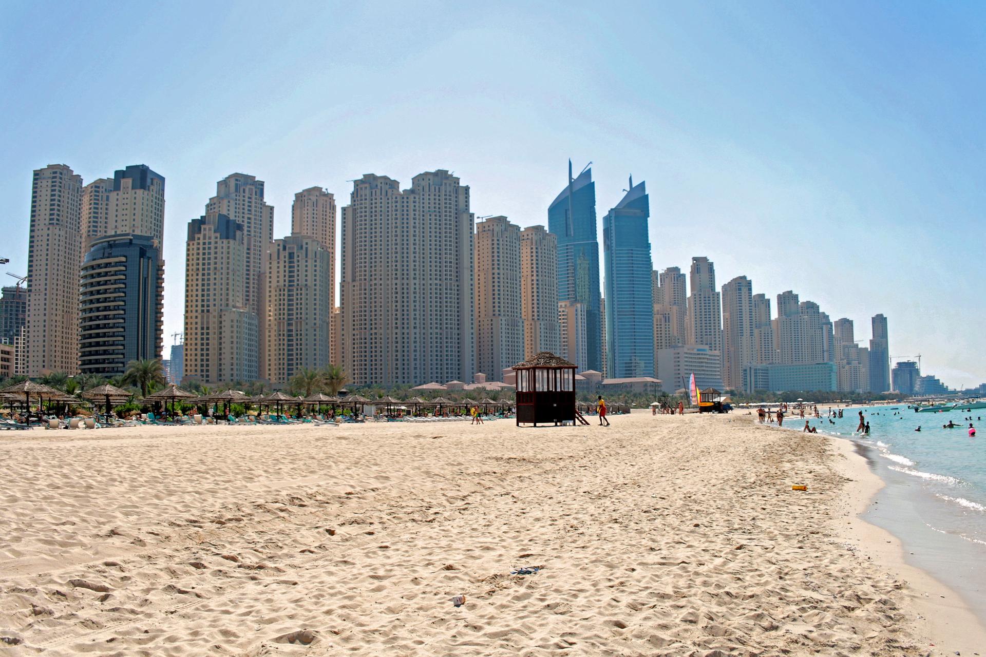 Dubai's Jumeirah Beach, with the high-rise towers of Dubai Marina rising along the Gulf shoreline
