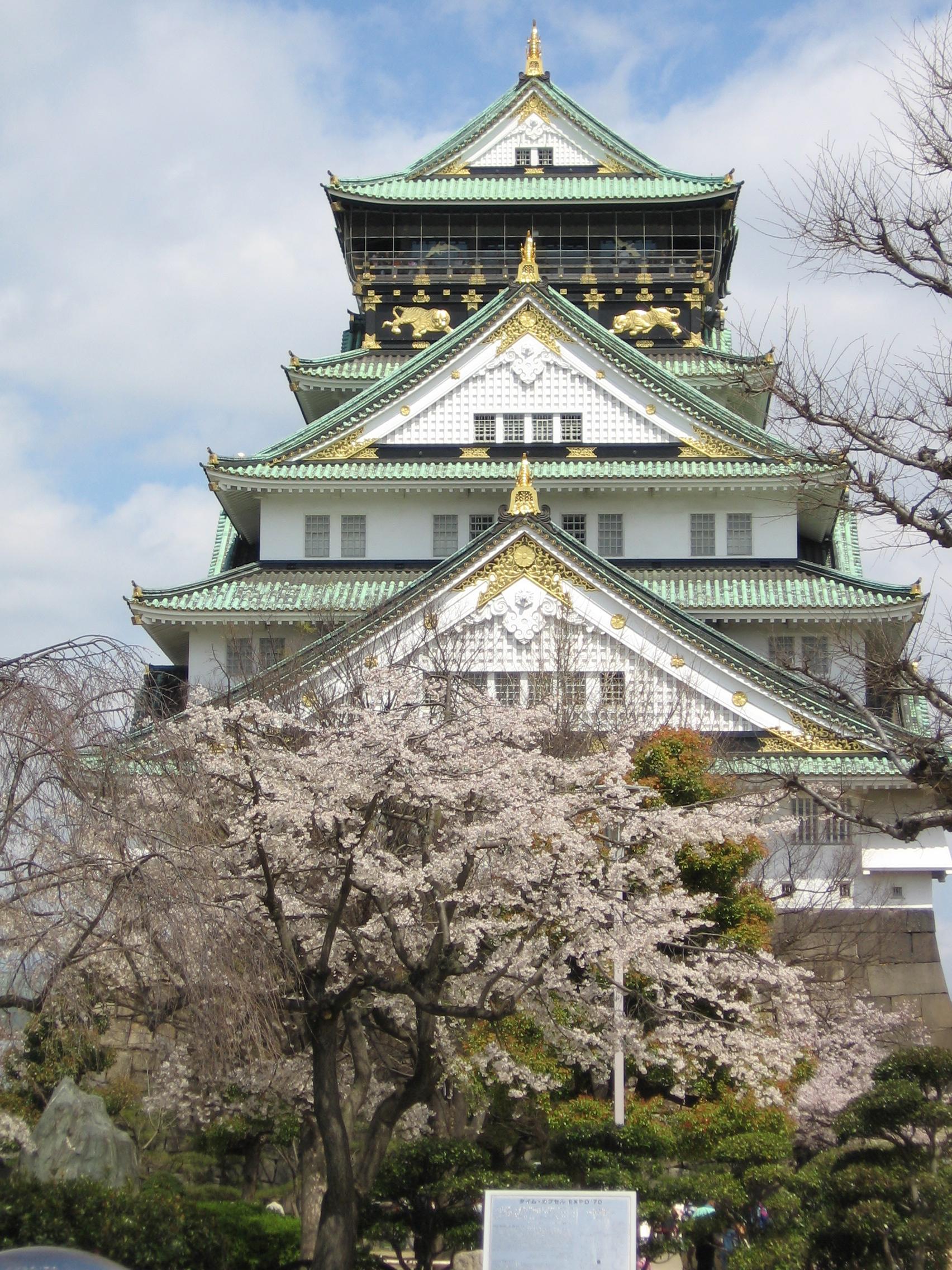Osaka Castle in spring with cherry blossoms — the Kansai city where Kenyan diplomats complete the Japan Foundation's foreign service language program