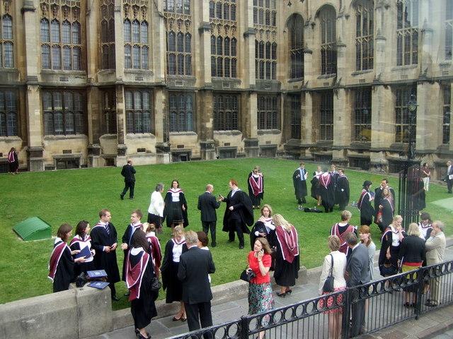 Graduating university students in caps and gowns at a degree ceremony, illustrating overseas study opportunities for Kenyans
