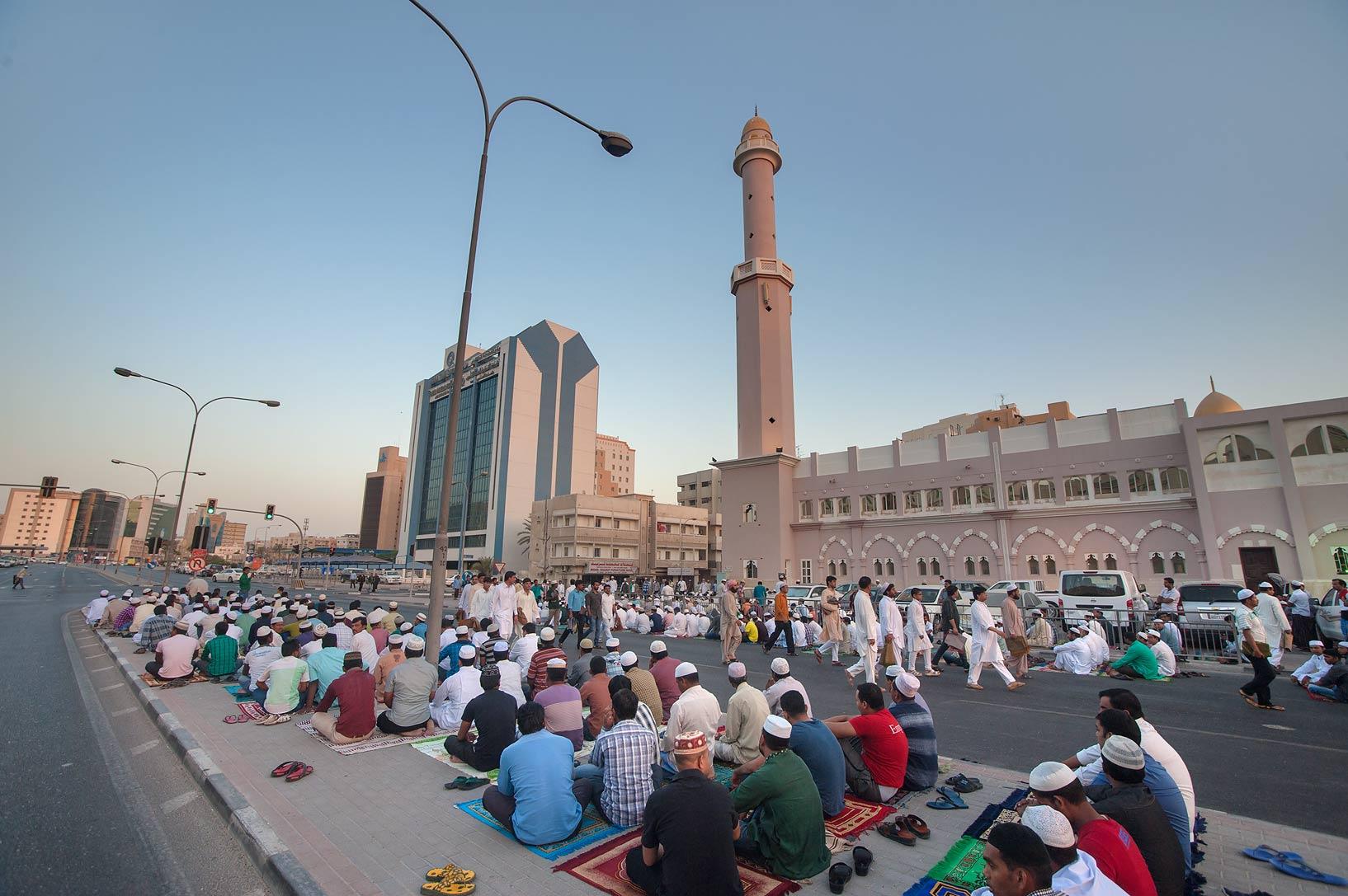 Worshippers gather for Eid al-Adha prayer in the open square near Al Asmakh Mosque in Doha, Qatar