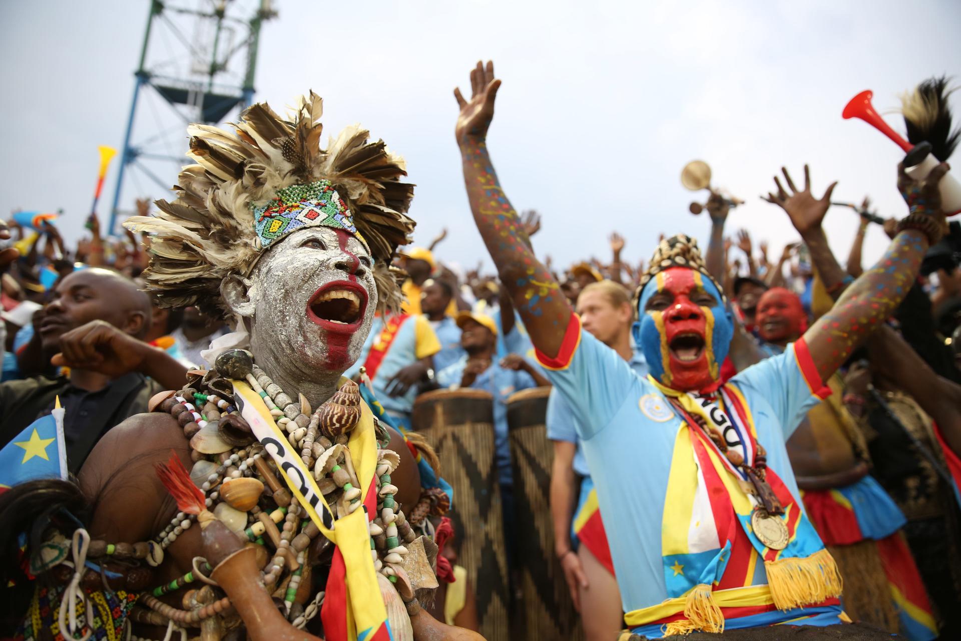 Democratic Republic of Congo football supporters celebrate in the stands during an international match.