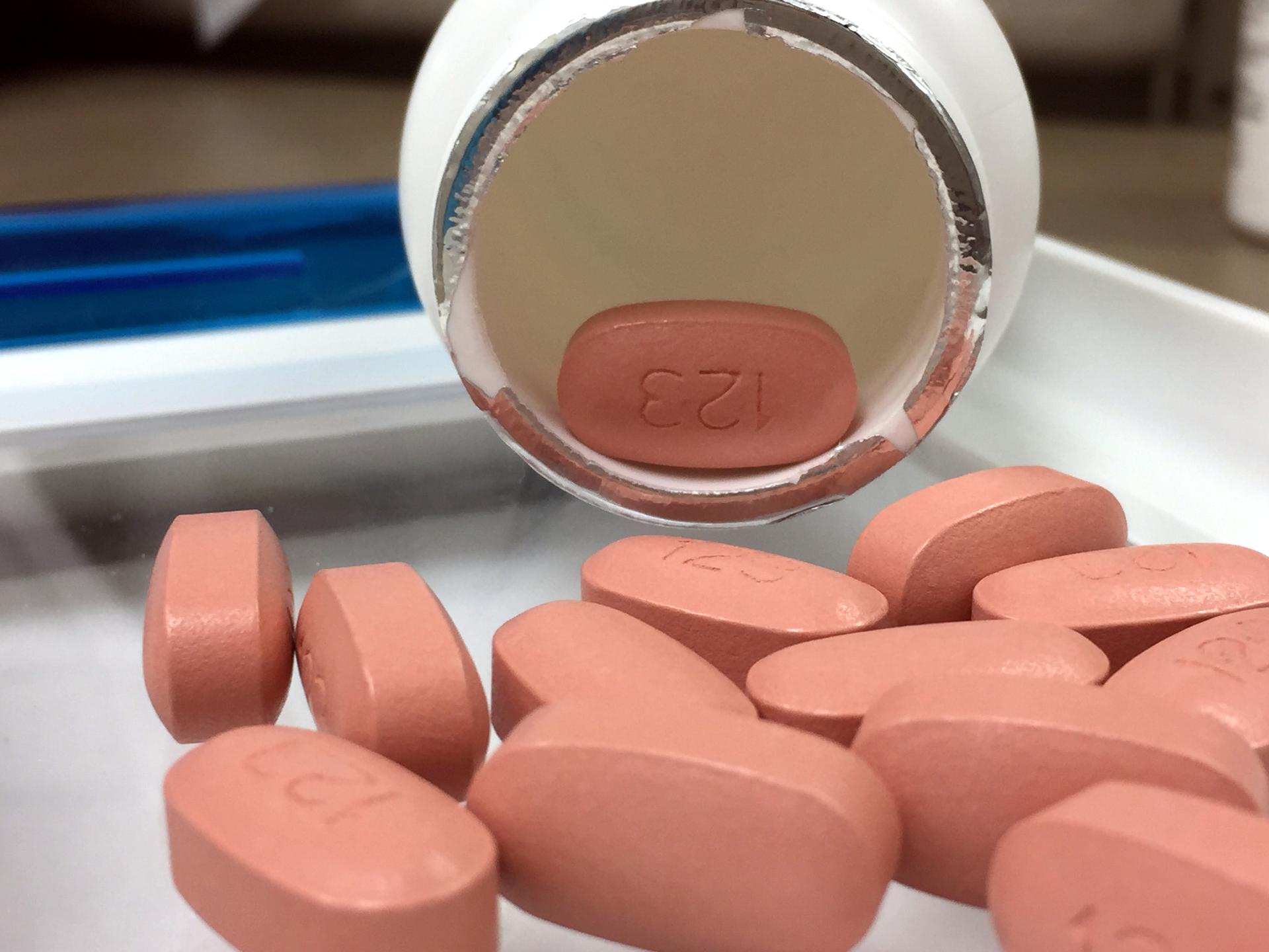 Antiretroviral HIV medication pills arranged on a flat surface