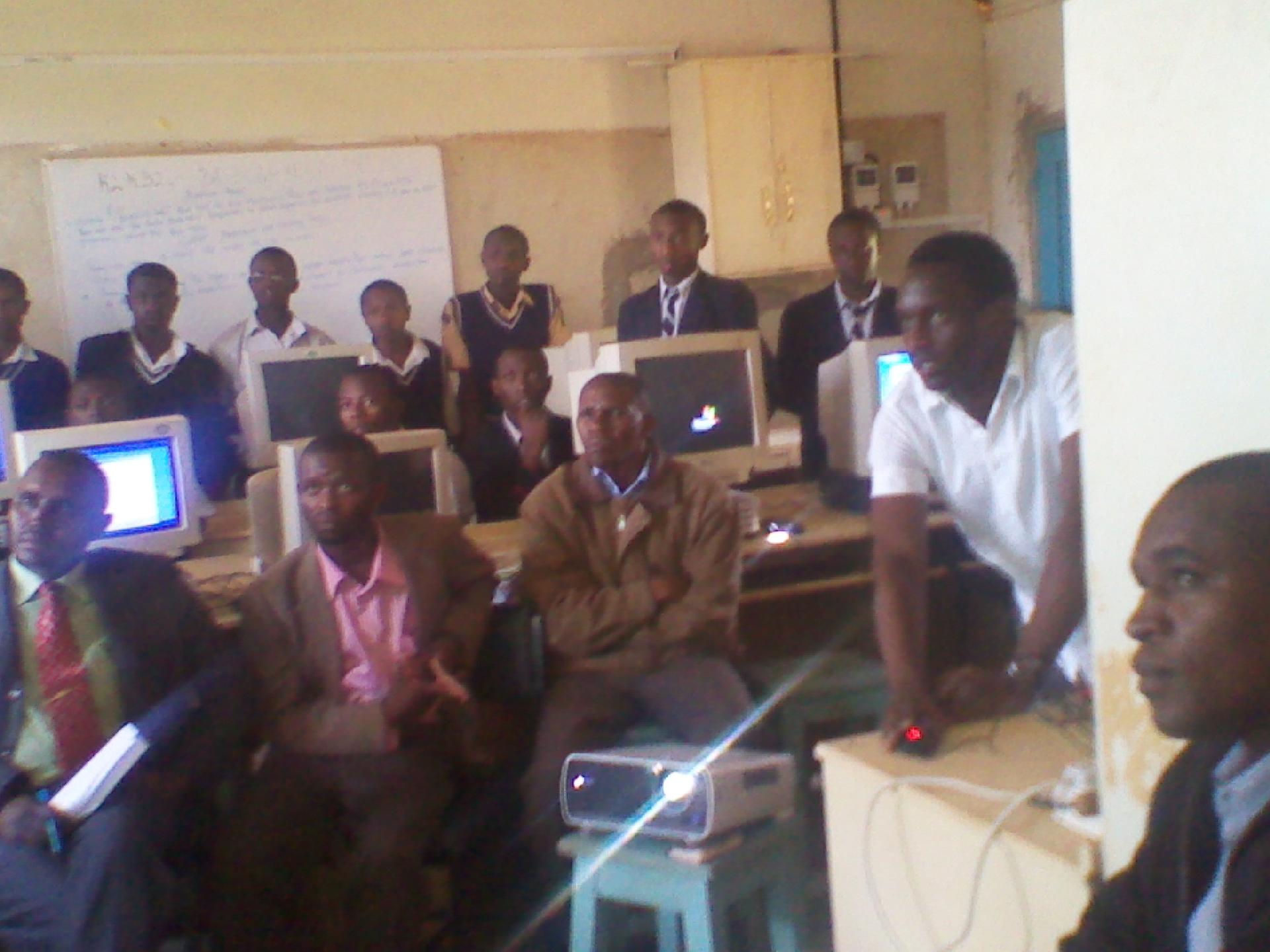 A classroom presentation to secondary school students in Kenya, illustrating the country's large pool of trained educators.