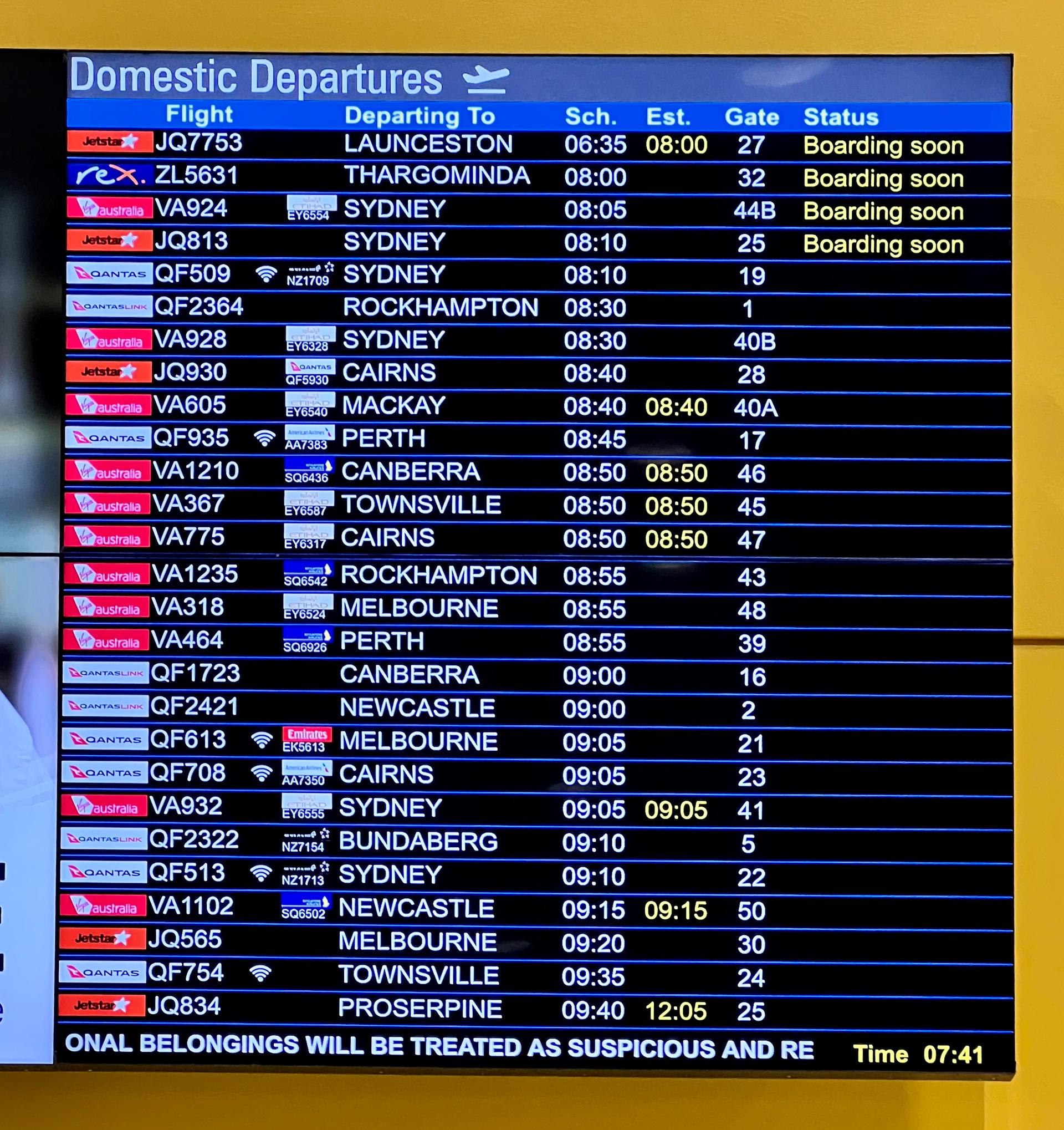An airport departures board listing flights, illustrating travel restrictions affecting East African passengers.