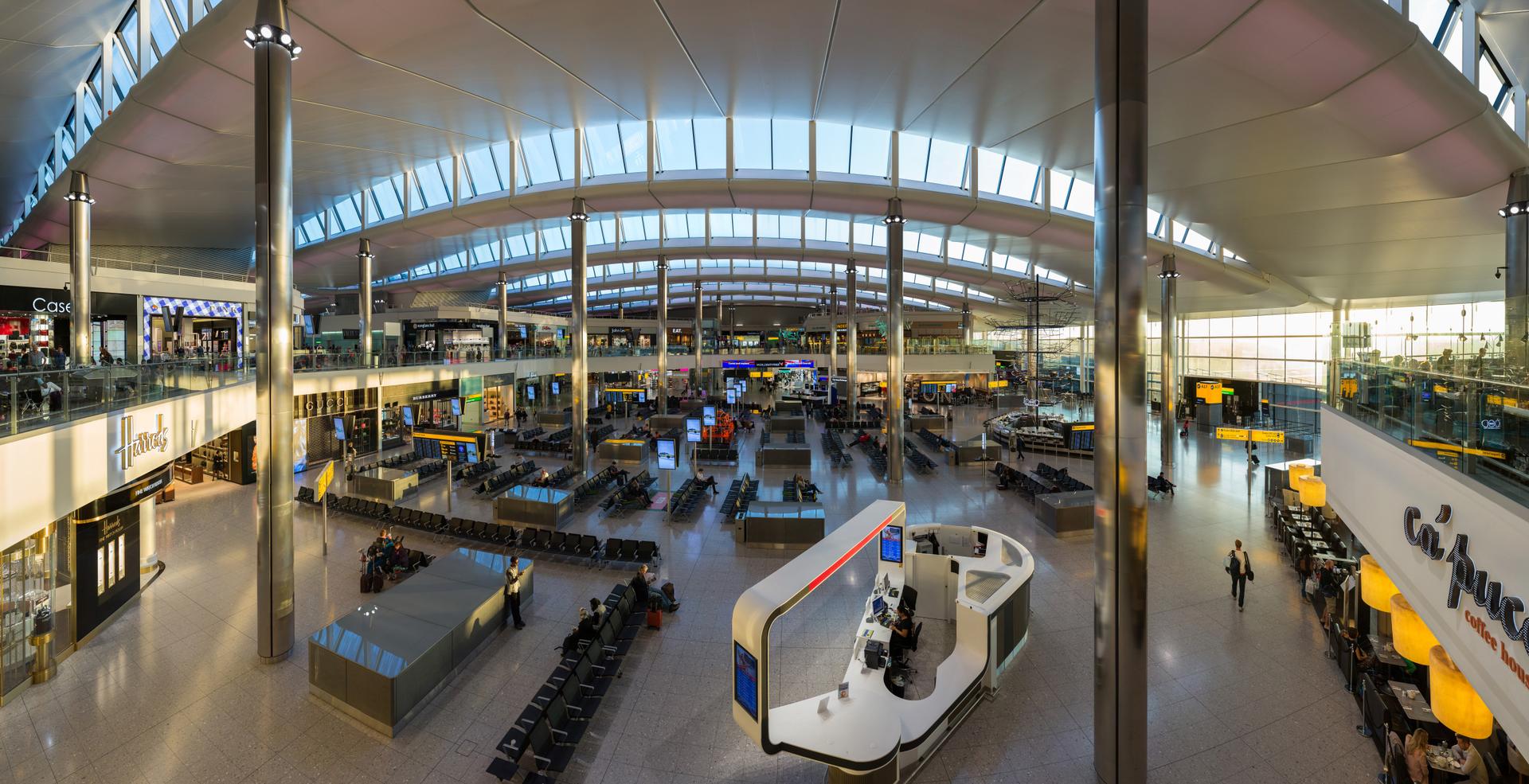 Travellers move through a busy airport departures hall, evoking the journeys of Kenya's growing diaspora.