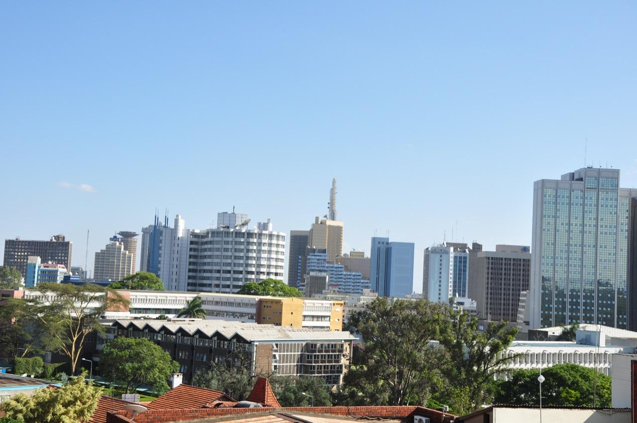 Nairobi's downtown skyline of office towers under a clear sky, viewed across Kenya's capital city.