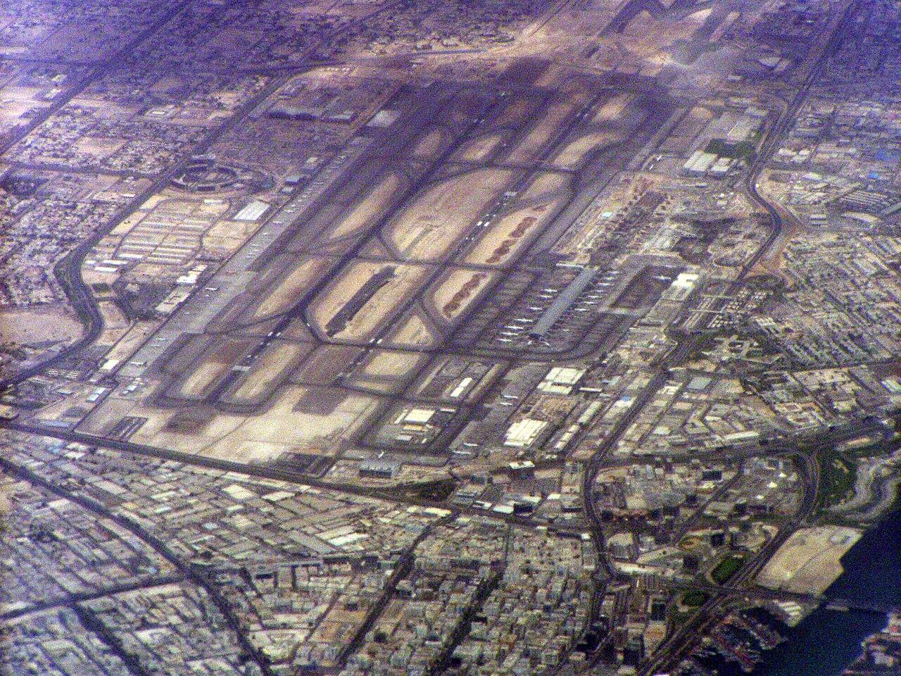 Travellers and aircraft at Dubai International Airport, a major hub for Kenyan workers in the United Arab Emirates