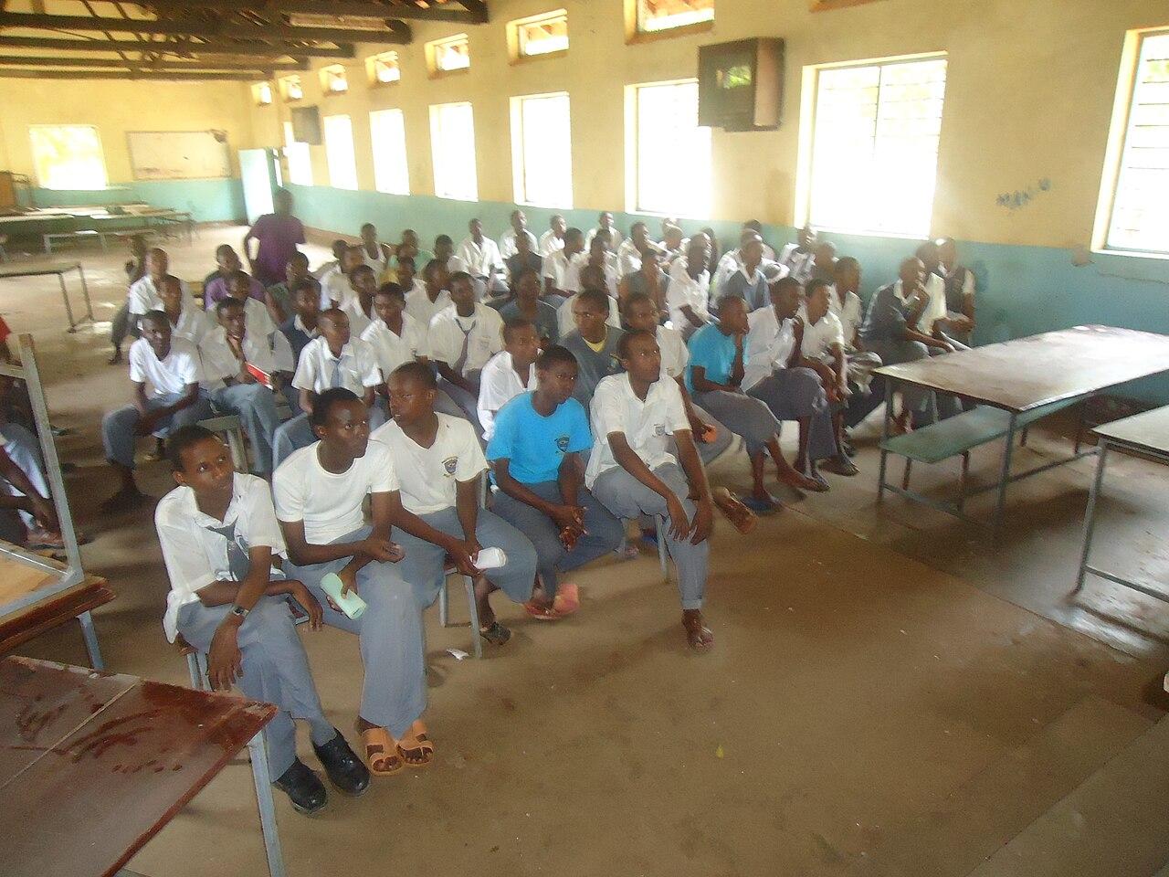 Students seated together in a classroom at Shimo la Tewa Secondary School in Mombasa, Kenya, during a school programme.