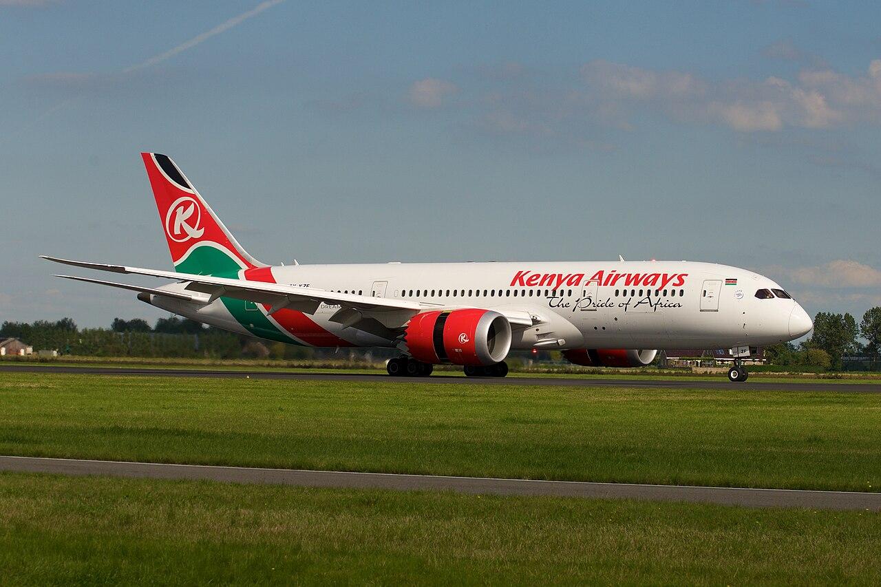A Kenya Airways Boeing 787-8 Dreamliner in flight showing its red, white and green livery
