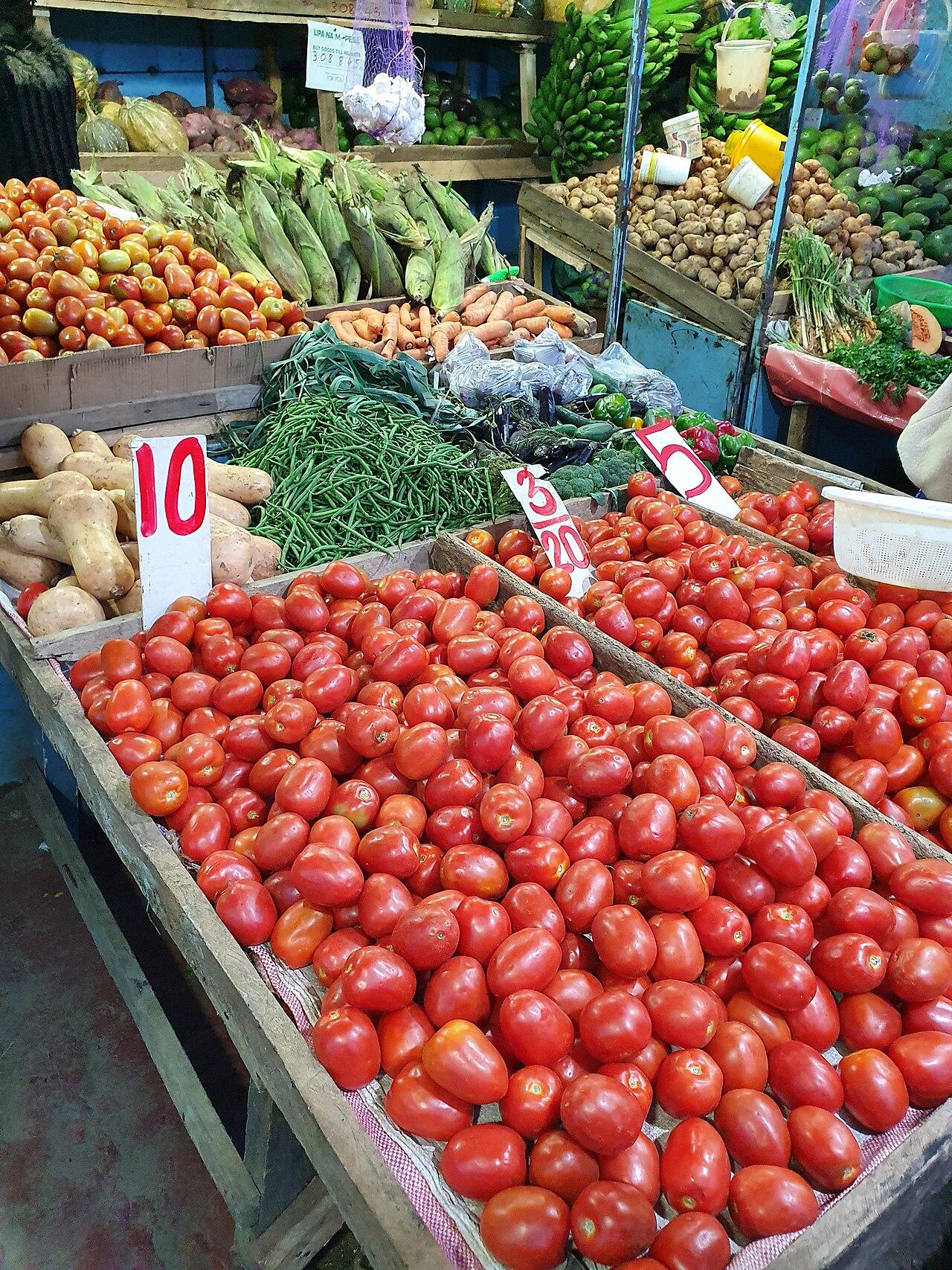 A vegetable stall on the outskirts of Nairobi stocked with fresh produce, where daily food prices are set