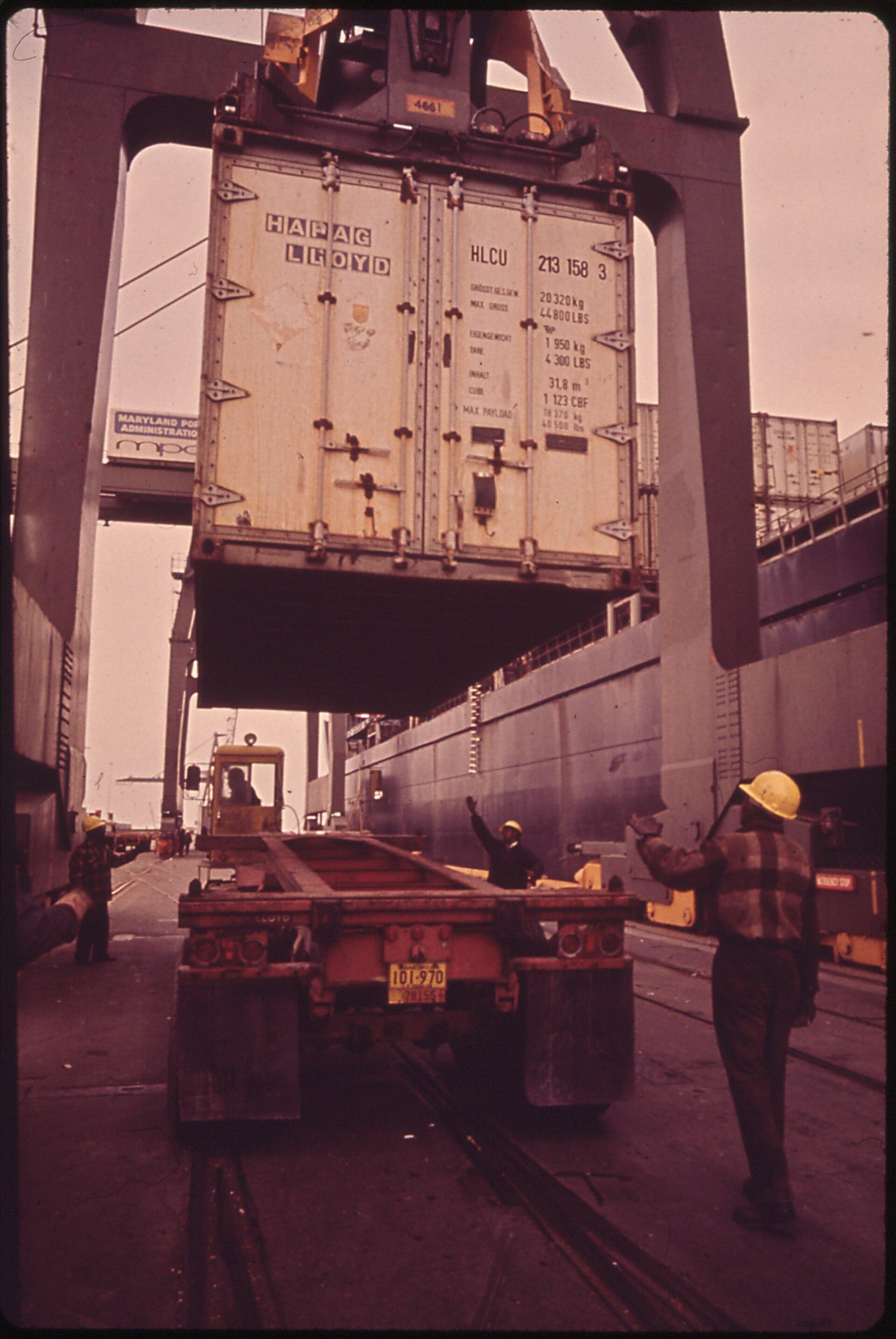Container cargo being unloaded by crane at a marine terminal, illustrating the seaborne trade corridor between Kenya and the United States.