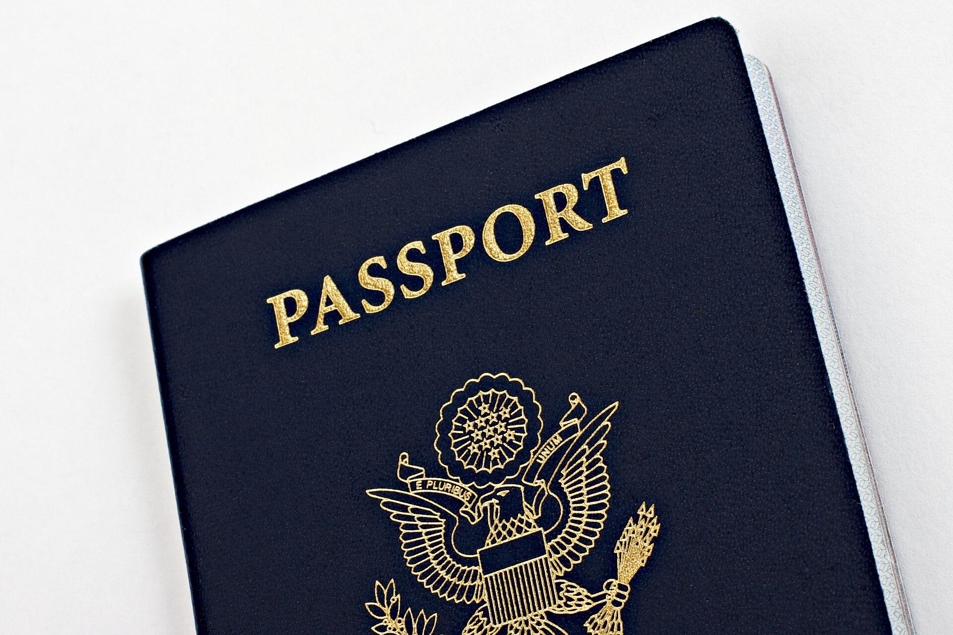 A United States passport book lying open, symbolizing visa and immigration pathways for foreign skilled workers.