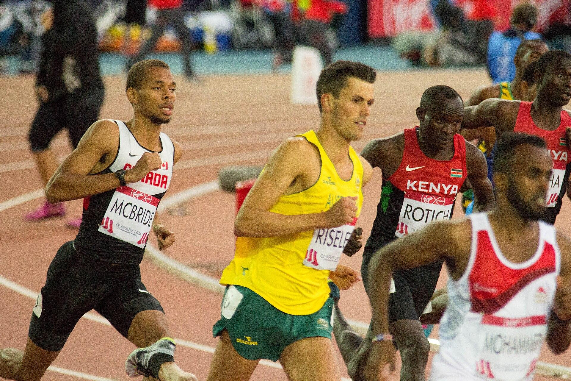 Athletes compete in a track race at the athletics stadium during the 2014 Commonwealth Games in Glasgow, Scotland.