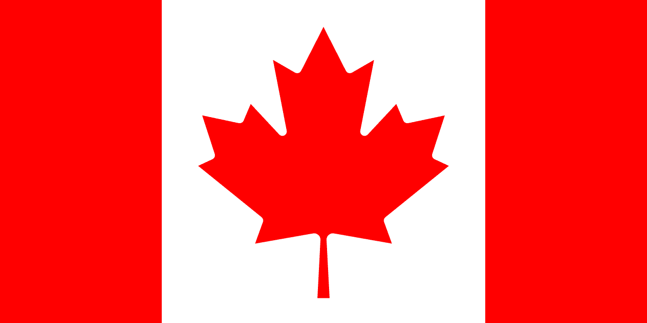 The red and white national flag of Canada with its central maple leaf, symbolising Canadian immigration policy.