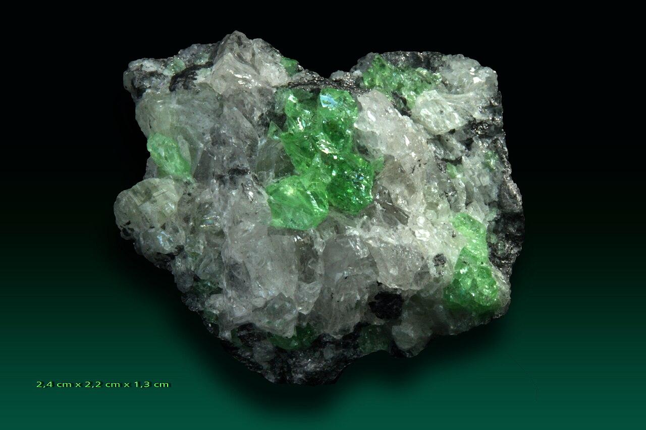 A green tsavorite garnet crystal specimen of the kind discovered by geologist Campbell Bridges in East Africa.