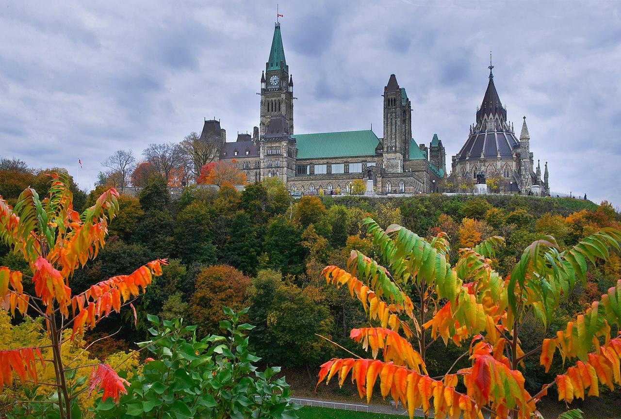 Parliament Hill and the Ottawa skyline rising above the river in Canada's capital city