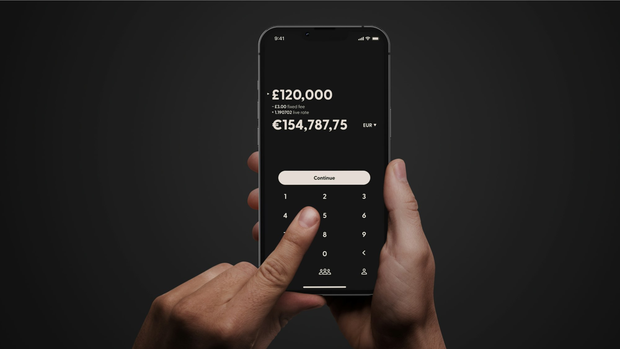 Close-up of two hands holding a smartphone open to a mobile banking app, mid-transfer, symbolising cross-border mobile money use by the diaspora.